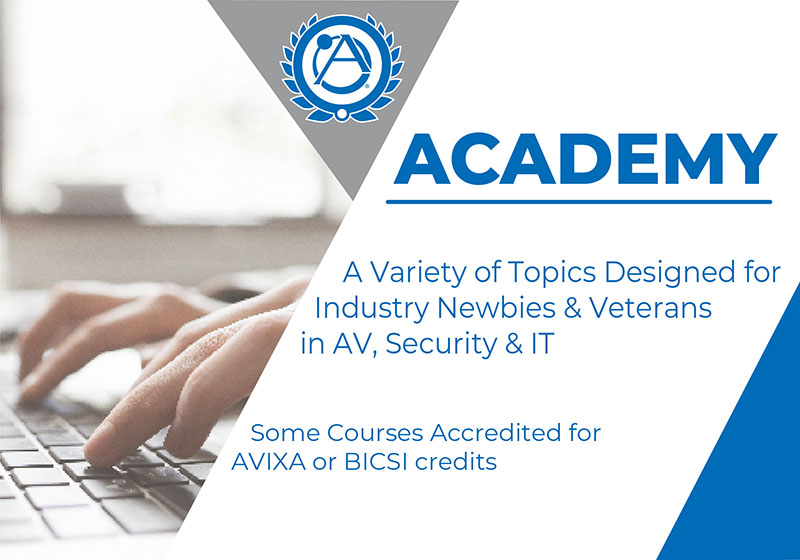 Hand using a laptop with AtlasIED Academy showing accreditation from AVIXA or BICSI